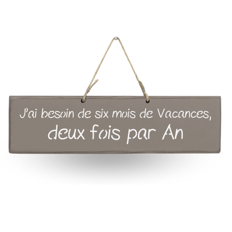 Humorous decorative sign: ‘I need six months' holiday, twice a year’